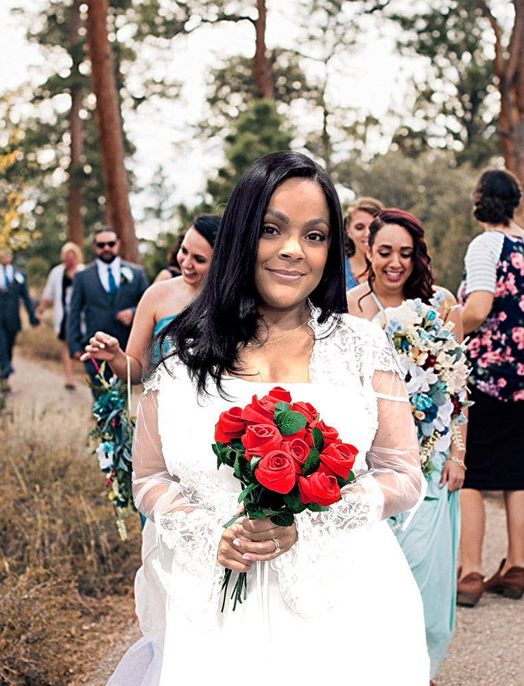 a bride walks with her wedding party